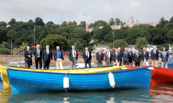 Members pose with the boats